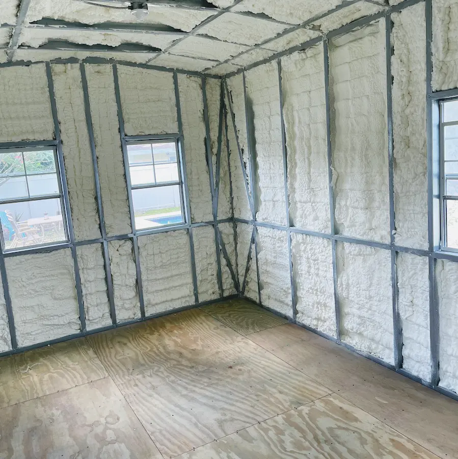 Closed-cell spray foam insulation applied to wall cavities in a residential project in Lawton